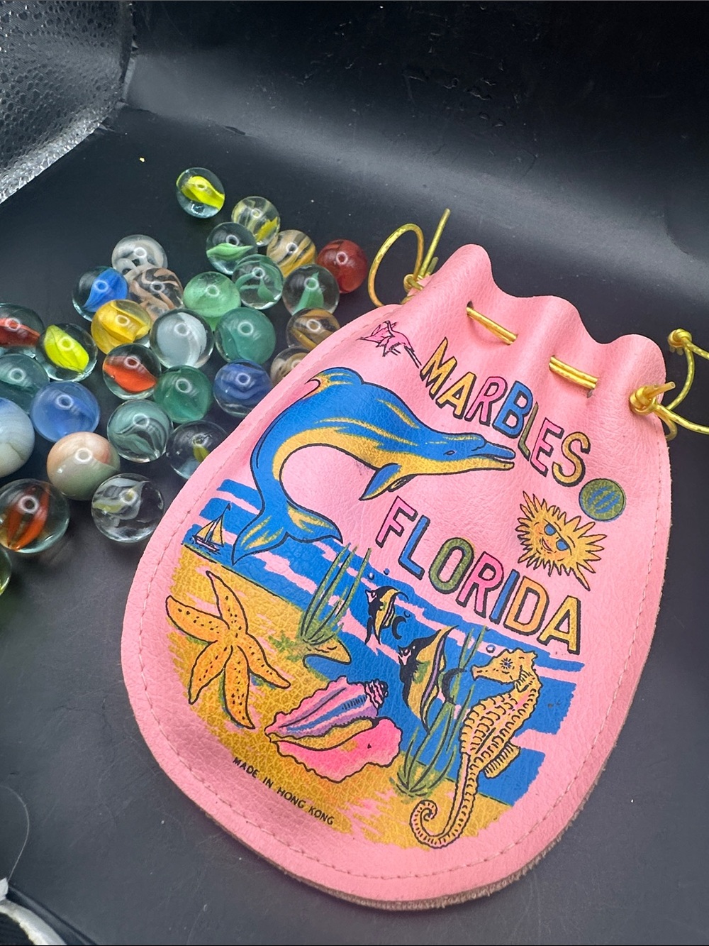 Vtg souvenir kids pouch of marbles 80s
